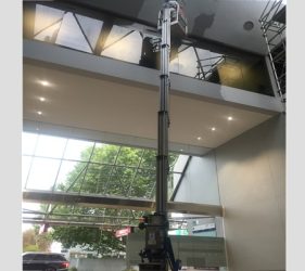 Platinum painter using a 16m Genie electric lift to paint the high ceiling at Northbridge commercial office.
