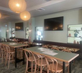 Dining Area – Spacious dining area with wooden chairs and pendant lighting.