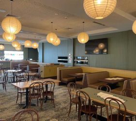 Dining Area – Spacious dining area with wooden chairs and pendant lighting.