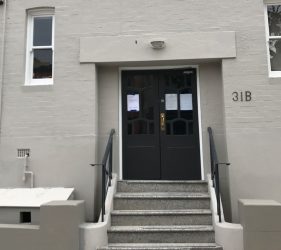 Entrance Upgrade – Repainted entrance with crisp new trim and doors.