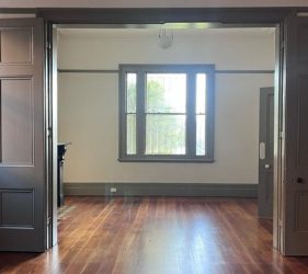 Finished living and dining room at Dulwich Hill with restored walls, fresh paint, and natural light