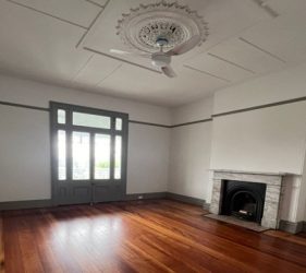 Living room completely restored with polished floors and crisp painted finishes in Dulwich Hill home