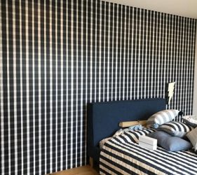 Black check feature wall behind bed in Balmain