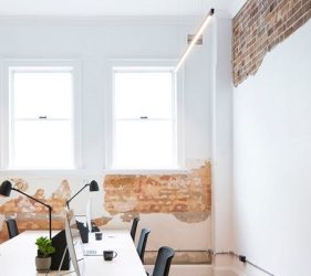 Modern office space in Crows Nest featuring restored exposed brick and clean interior finishes