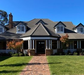 Fully repainted front elevation of the Forestville home with updated roof, trim, and entry