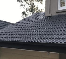 Fully completed roof painting project in Sydney with tiles looking brand new.