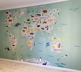 Completed wall mural of illustrated world map in Clovelly