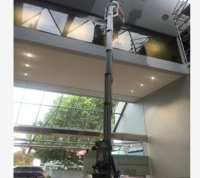 Ceiling paint prep using lift in Northbridge lobby