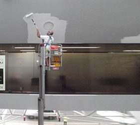 Electric lift used for indoor high ceiling painting in Northbridge offices