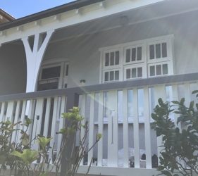 Restored and freshly painted front verandah of federation home in Mosman, showcasing detailed fretwork and balustrades