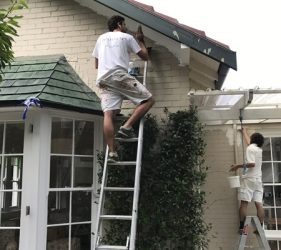 Painting in progress on a heritage home in Mosman, focusing on soffits, walls, and courtyard areas