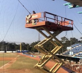 Painting under grandstand with scissor lift at Sydney stadium