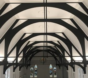 Bright white painted church ceiling with black-stained beams completed in Surry Hills office conversion